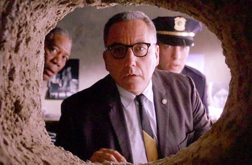 Men looking through a tunnel: scene from Shawshank Redemption